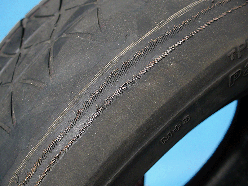 exposed tire ply or cording