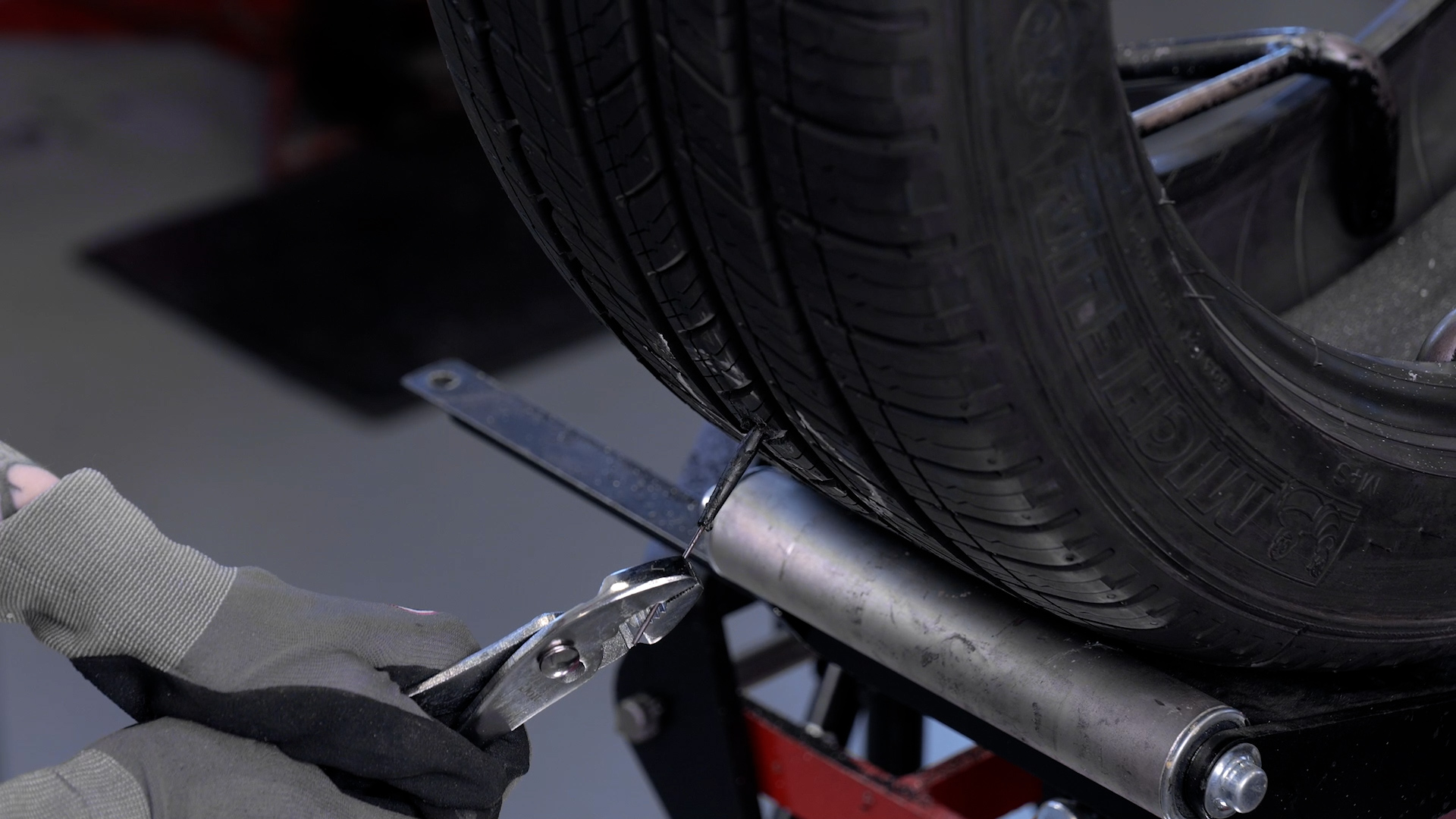 Use the lead wire to pull the repair through the tire